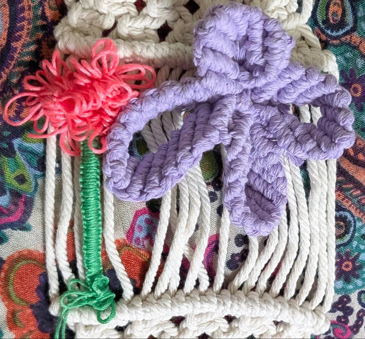 Detailed squared knot on silky thread flower and macrame cord butterfly